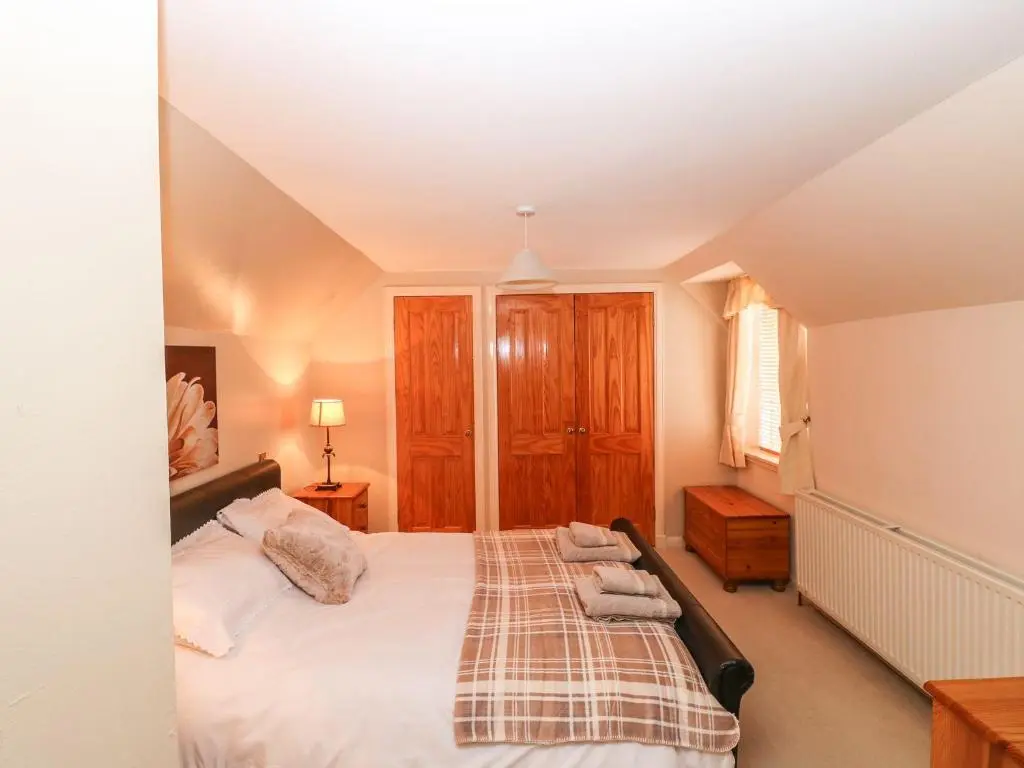 a bedroom with a bed in a room at Harbour View in Buckie