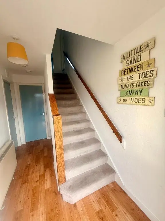 a staircase in a house with a stair case at Spacious 2 Bedroom Home in Picturesque Cullen in Cullen