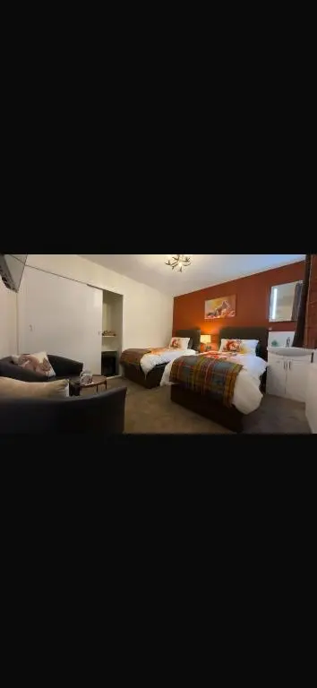 two pictures of a hotel room with two beds at Haste Ye Back in Inverness