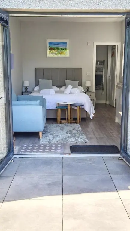 a living room with a bed and a couch at Fyrish View in Dingwall