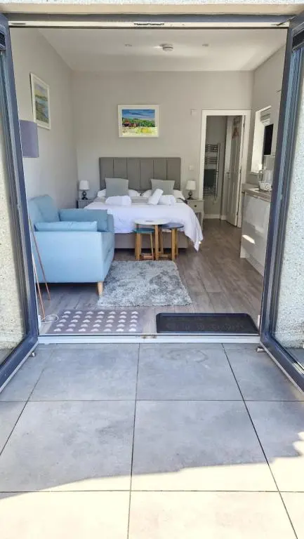 a living room with a bed and a couch at Fyrish View in Dingwall