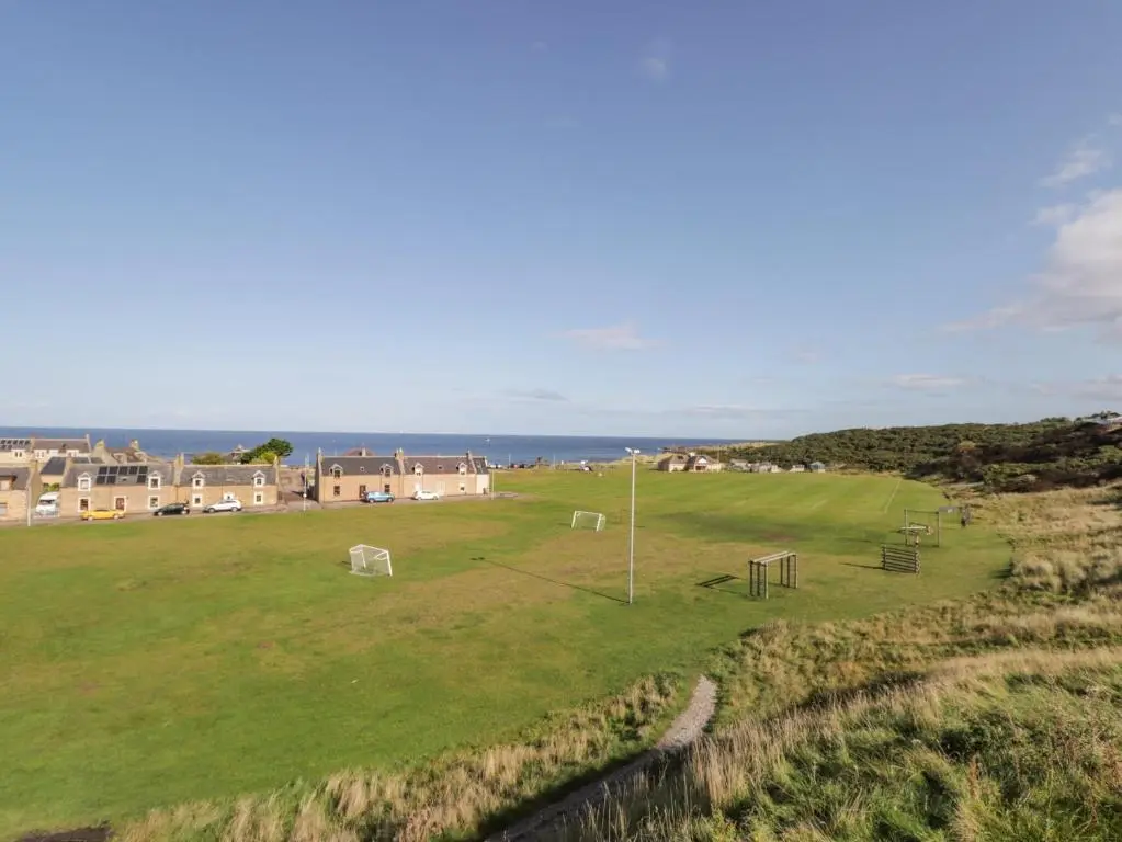 a large field with a soccer ball in the grass at Seaview at The Doocot in Elgin