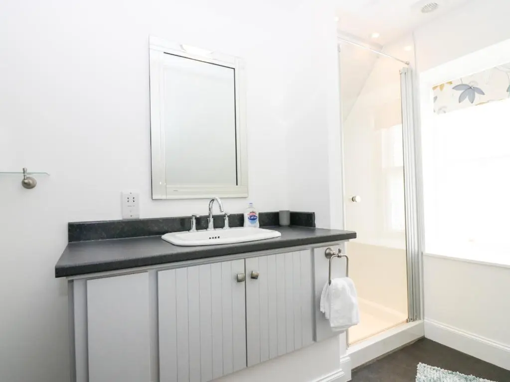a bathroom with a sink and a mirror at Hayloft in Peterhead