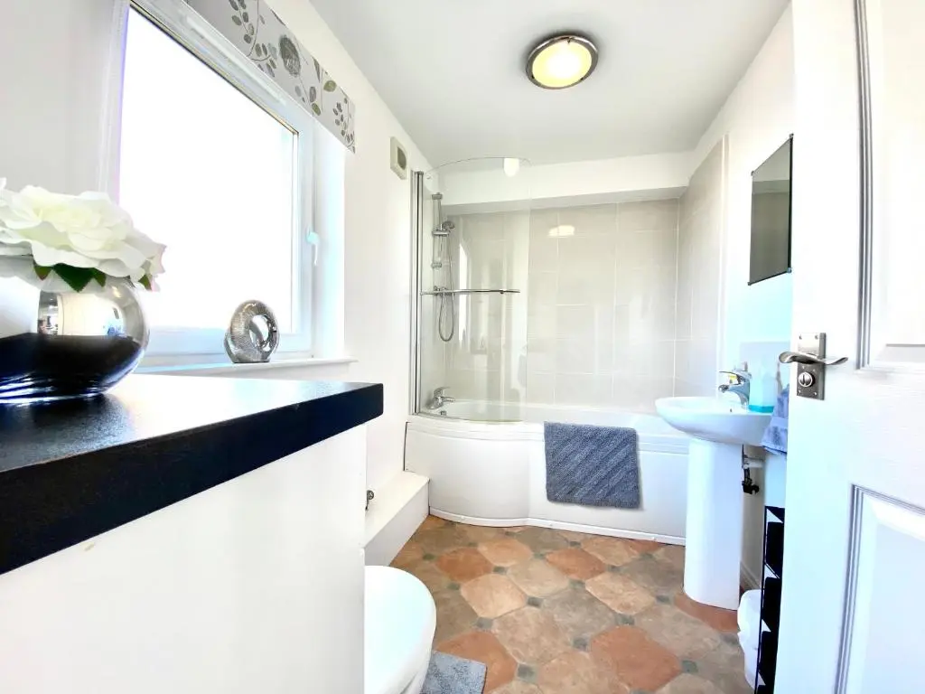 a bathroom with a toilet and a sink at Modern Spacious, Near Marina - Commerce Street, Lossiemouth - Free Parking, WiFi in Lossiemouth