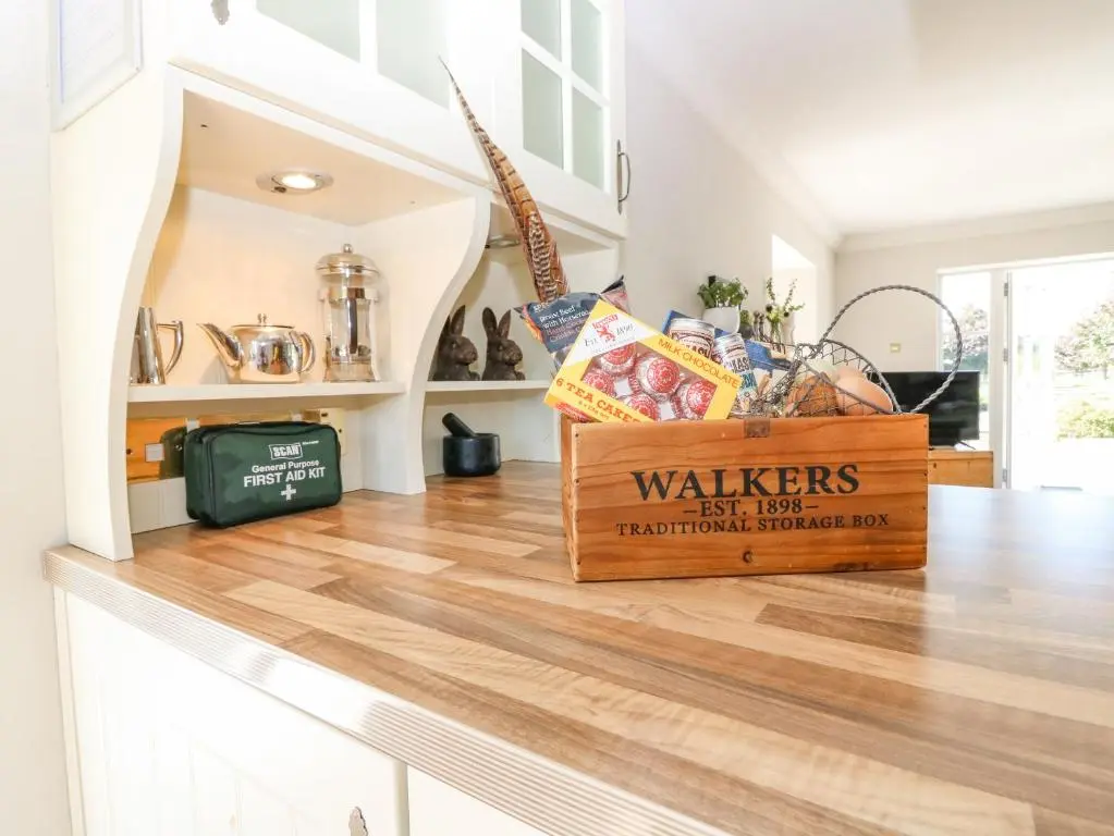 a kitchen counter with a box of walkers on it at Stable Cottage in Inverurie