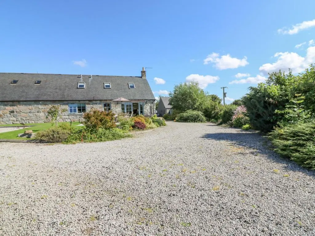 an empty driveway in front of a house at Stable Cottage in Inverurie