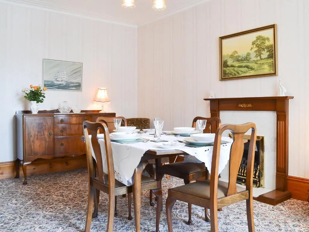 a dining room with a table and chairs at Number 12 in Portknockie