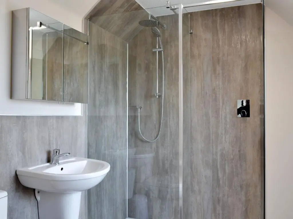 a bathroom with a shower and a sink at Inver House Apartment in Inverurie