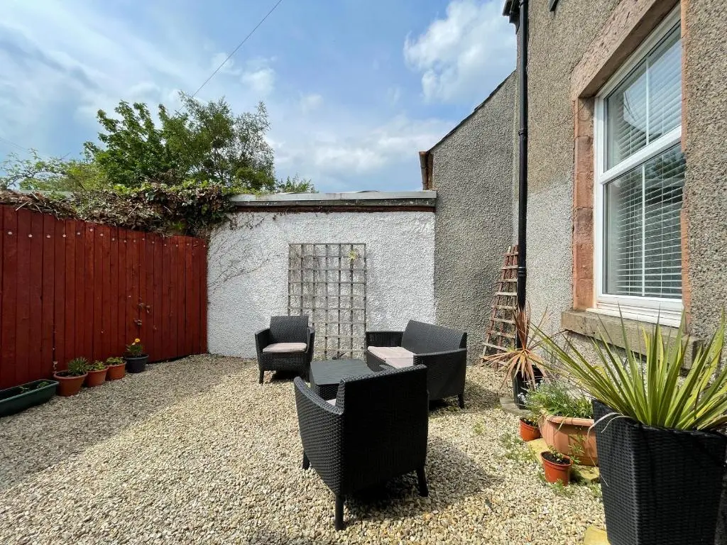 a patio with chairs and a table and a fence at Stanford House in Inverness