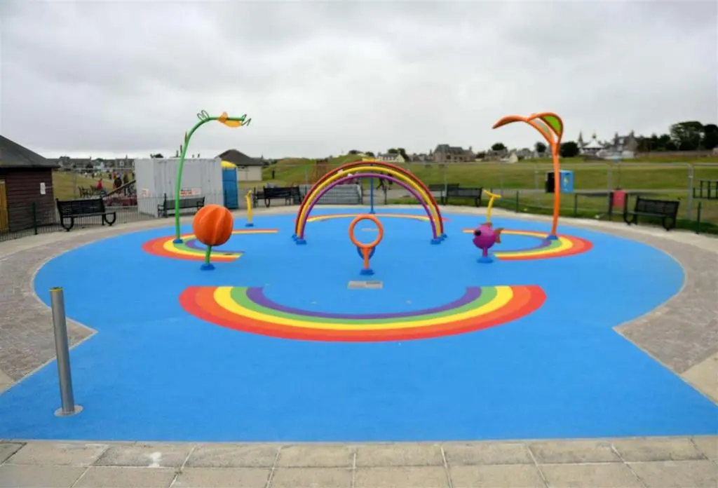 a playground with a blue floor and several different rides at Four Winds Holiday Let in Nairn