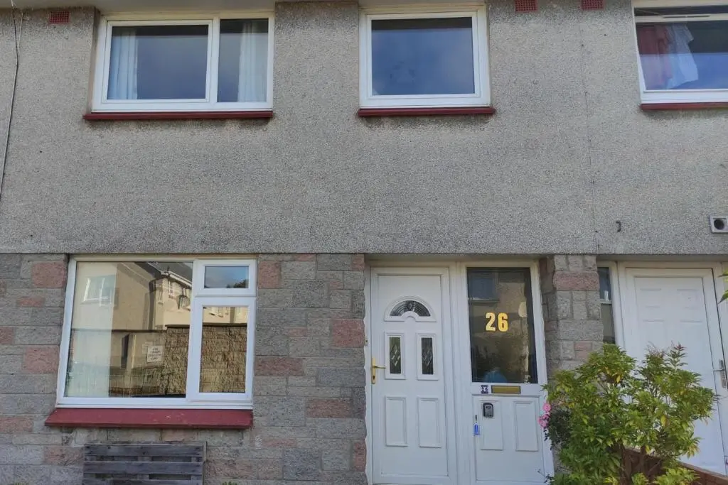 a building with two white doors and windows at 3-Bed House Sleeps 5 5 min walk from City Centre in Inverness