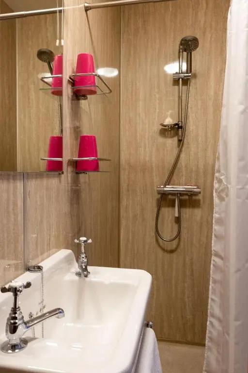 a bathroom with a sink and a shower at Marcassie Farm Lodges - Birch Studio in Forres