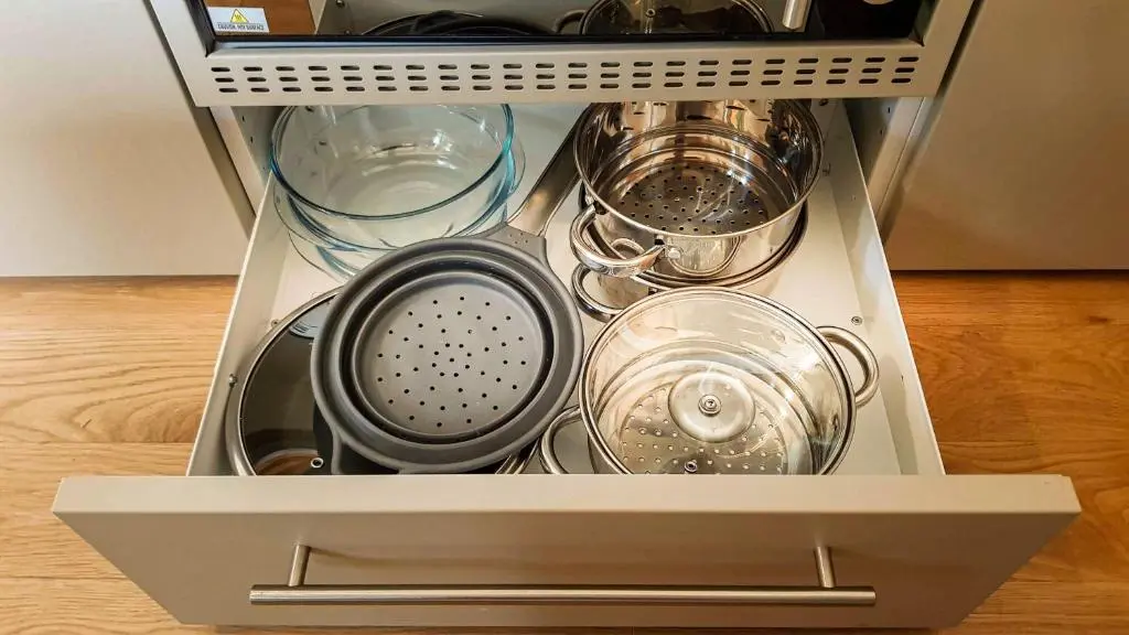 a drawer filled with dishes and other kitchen utensils at Marcassie Farm Lodges - Hazel Studio in Forres