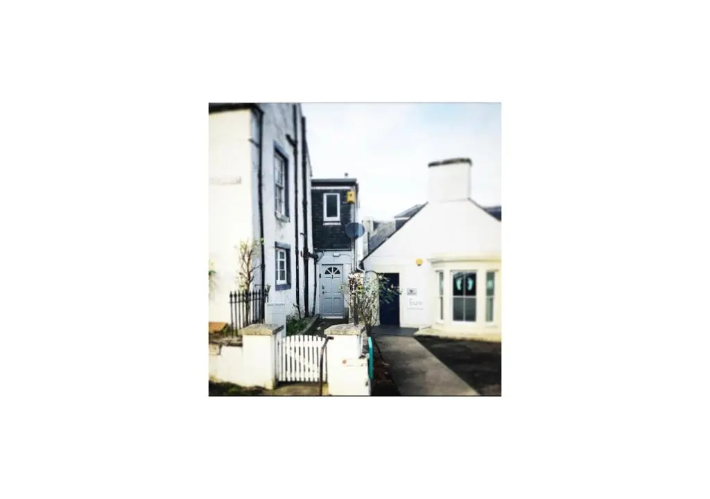 a black and white photo of a house at Grey Apartment in Inverness