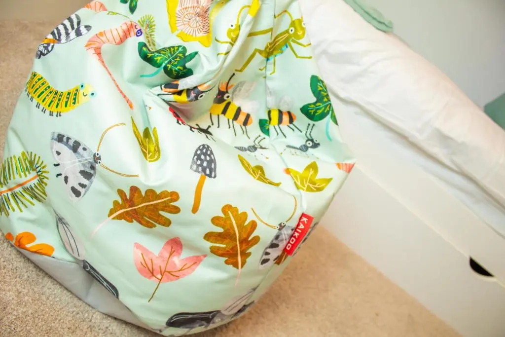 a diaper bag with leaves on it sitting on the floor at Alpine View - a cosy Aviemore House in Aviemore