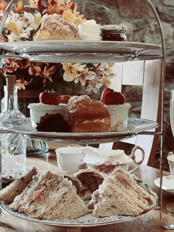 a plate of pastries and cakes on a table at The Aberlour Hotel in Aberlour