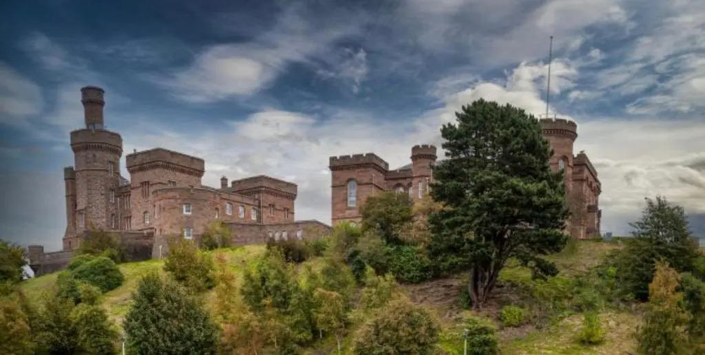 an old castle on top of a hill at Inverness city apartments - Innes in Inverness