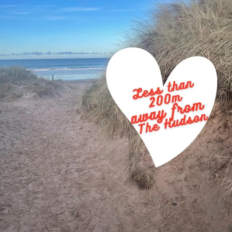 a heart on the beach with the words born away from the holidays at The Hudson @ Silversands in Lossiemouth