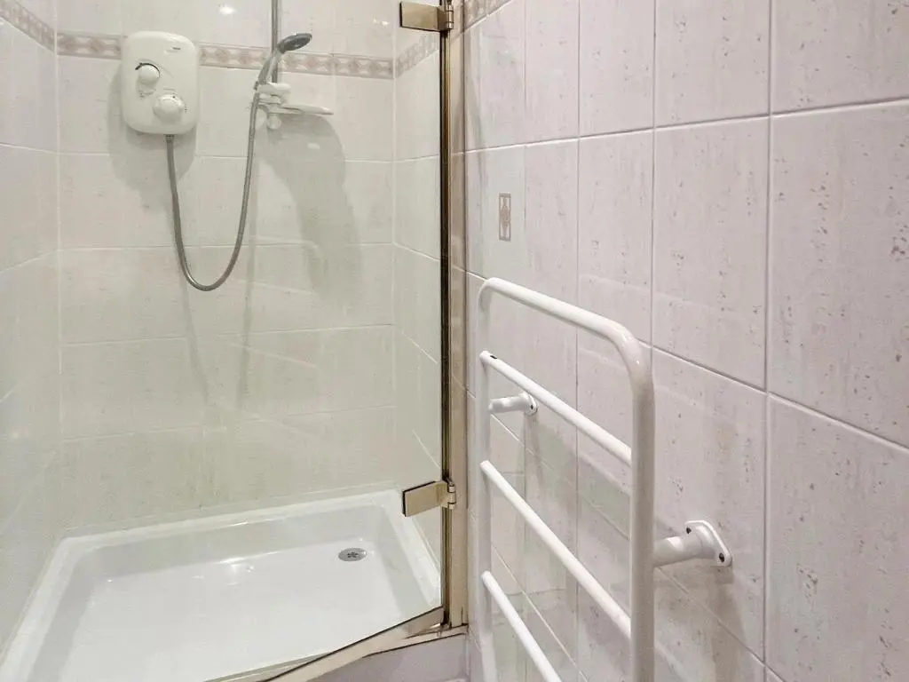 a shower with a glass door in a bathroom at Oich View - Uk37554 in Kilfinnan