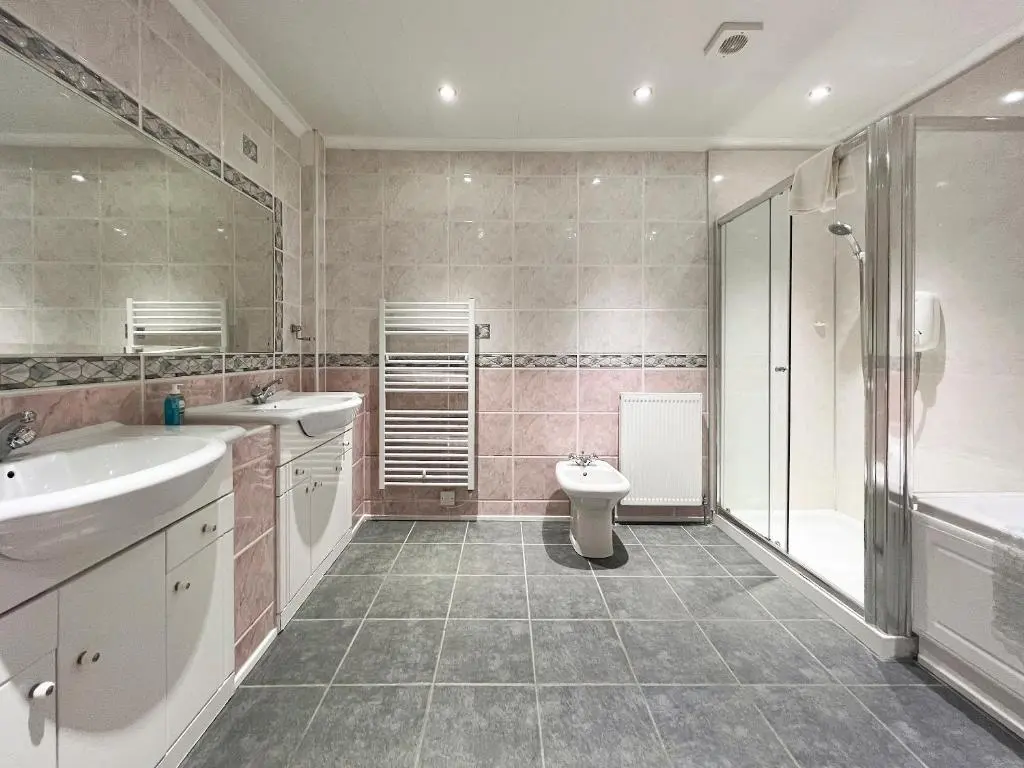 a bathroom with two sinks and a toilet and a shower at Oich View - Uk37554 in Kilfinnan