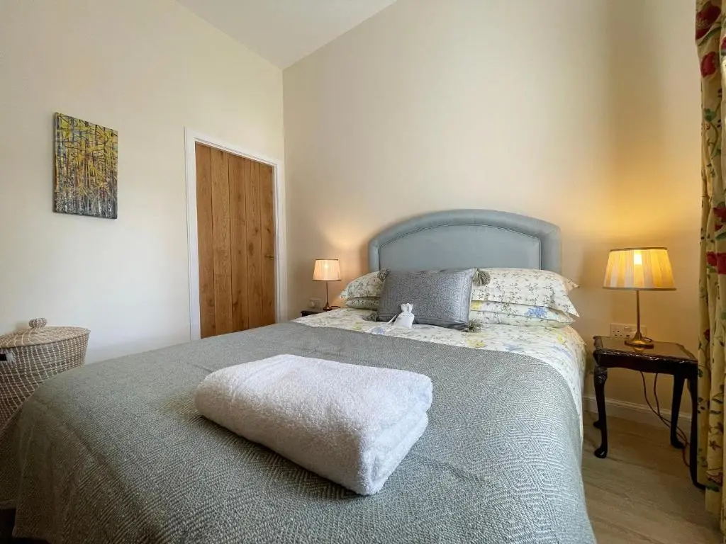 a bedroom with a bed with a white pillow on it at Farr Out in Farr