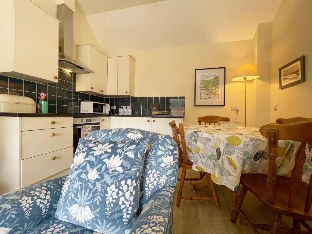a kitchen with a table and a dining room at Farr Out in Farr