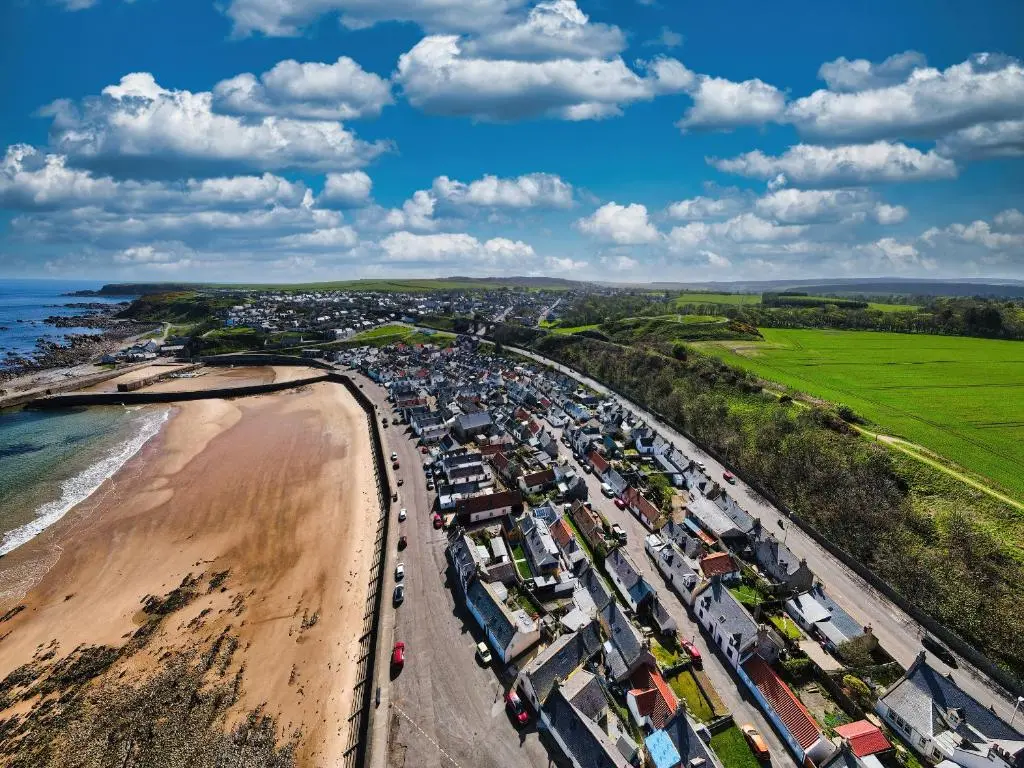 an aerial view of a beach and the ocean at Eider Cottage in Buckie