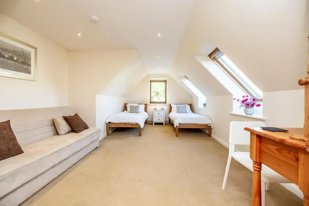 a living room with a couch and two chairs at Stunning Country House - Cinema, Games Room & Hot Tub in Inverurie