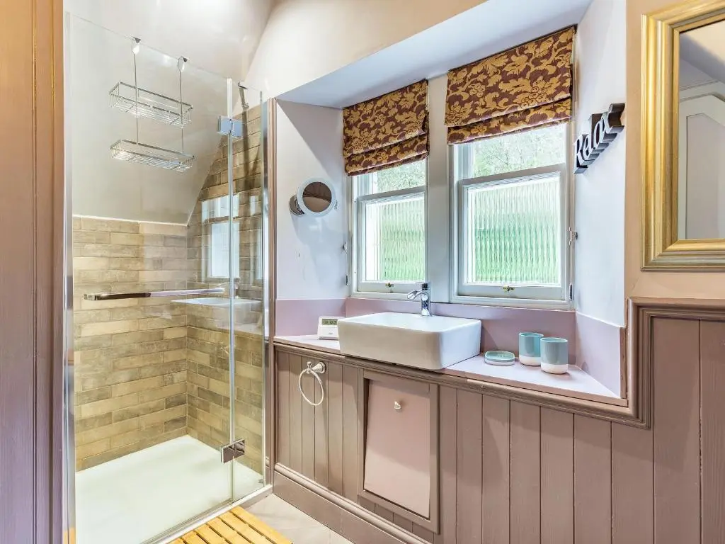 a bathroom with a sink and a shower at East Lodge in Contin