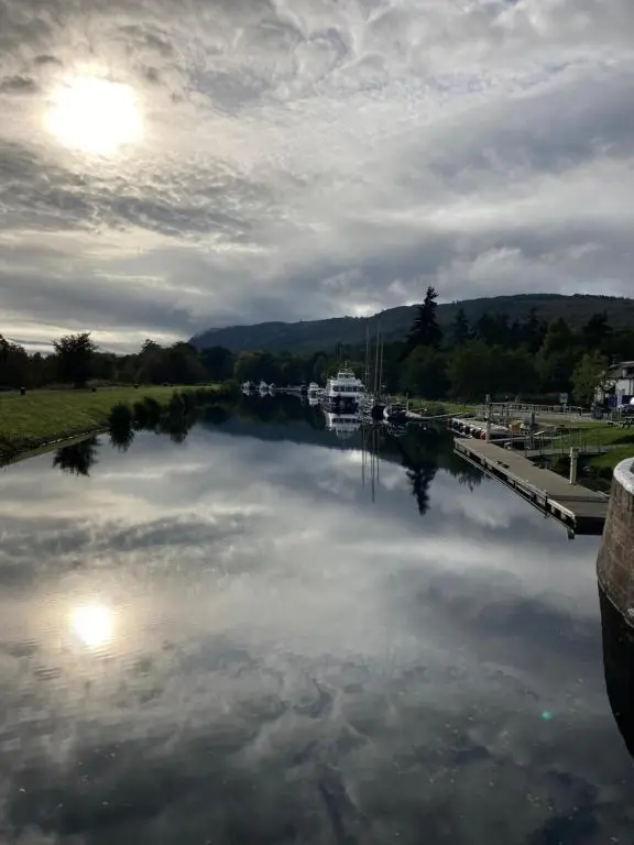 a large body of water with a boat in it at Balmridge House, Loch Ness, Bed & Breakfast in Drumnadrochit