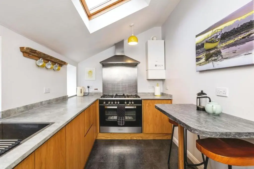 a kitchen with a stove and a counter top at 29 Seafield Street in Whitehills