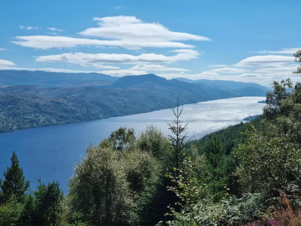 a view of a lake with trees and mountains at Rose Cottage City Centre in Inverness