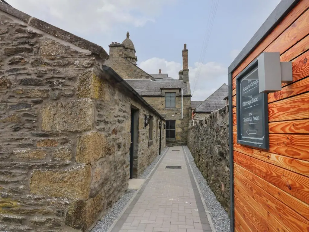 an alleyway in an old stone building at The Reception Room at The Institute Executive Apartments in Keith
