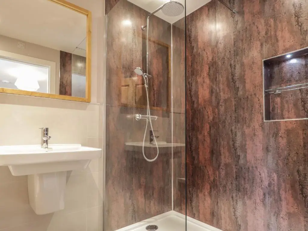a bathroom with a shower and a sink at Old Manse in Muir of Ord