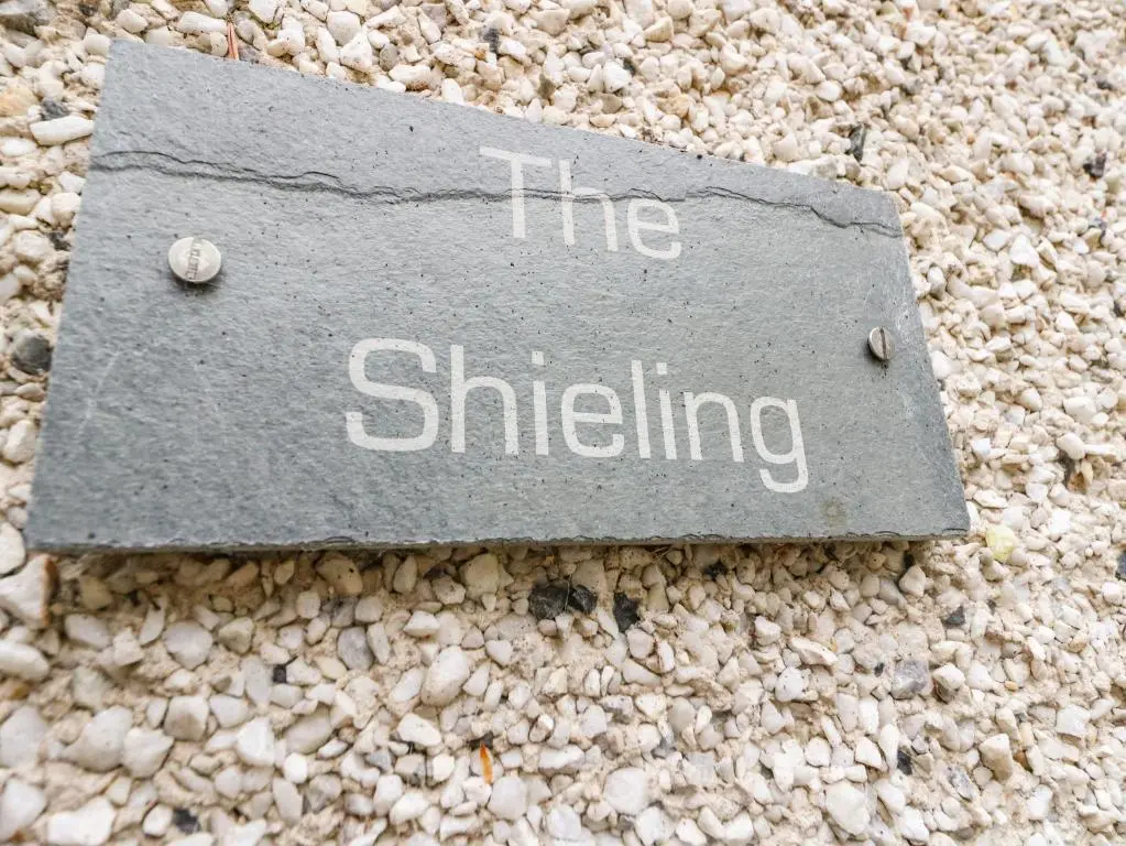 a sign that says the shifting on a rock at The Shieling in Newtonmore
