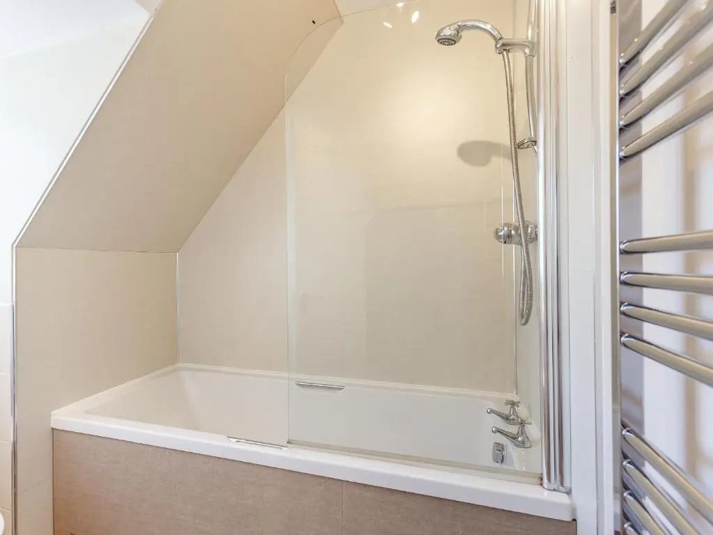 a bathroom with a shower with a tub at Willow Cottage - Uk39244 in Inverness