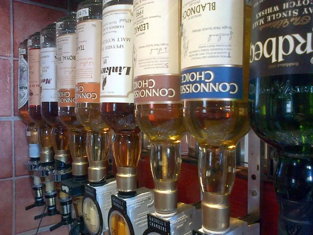 a display of wine glasses and bottles of wine at Aurora Hotel & Italian Restaurant in Nairn