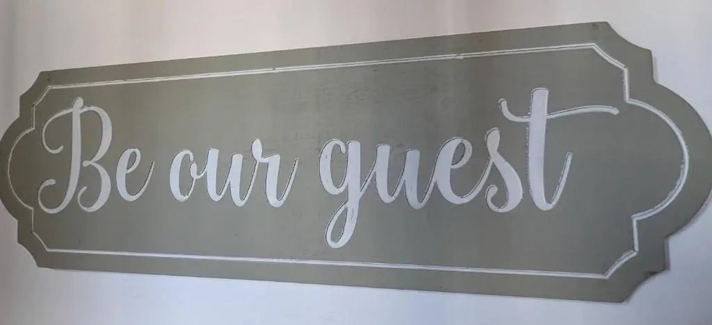 a sign that says be our guest on a wall at Kaoglen Squirrel Drey-Hot Tub-Pet Friendly-Perth in Balnald