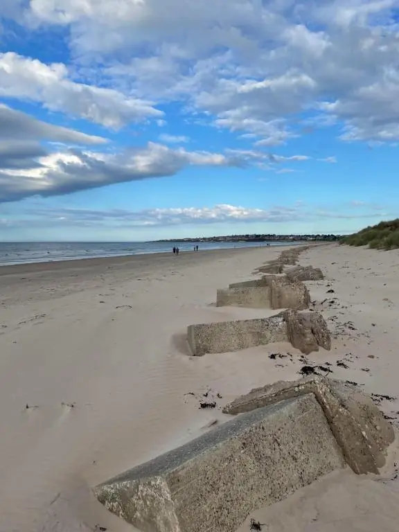 a beach with some steps in the sand at Dune View Caravan in Lossiemouth