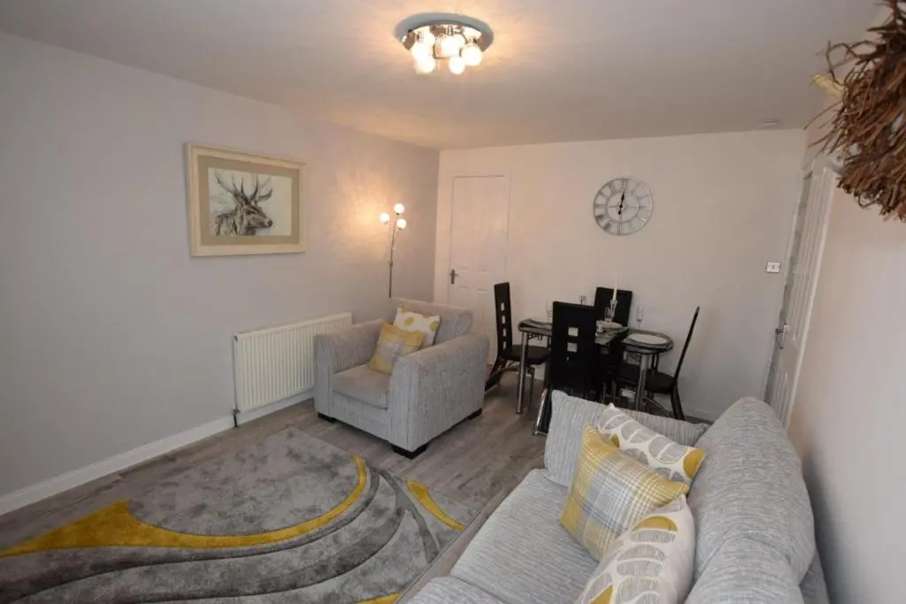 a living room with a couch and a table at Silver Key Apartments III in Inverness