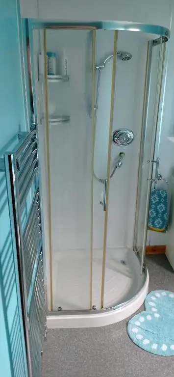 a shower with a glass enclosure in a bathroom at Isla Way Stays in Keith