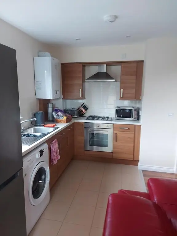 a kitchen with a washer and a washing machine at The Mews in Inverness