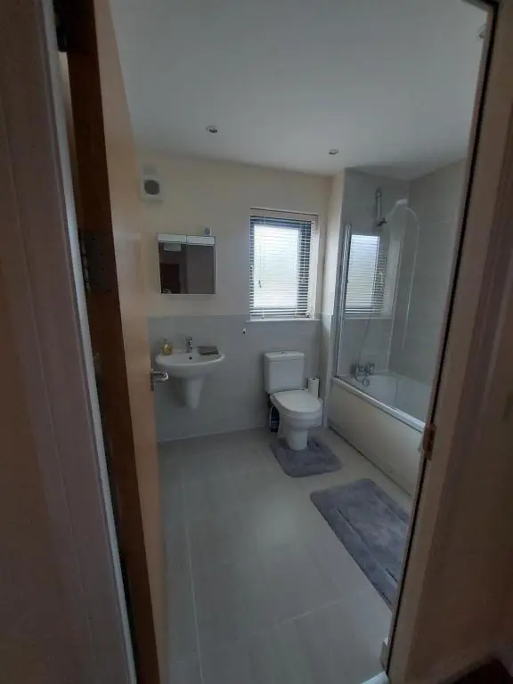 a bathroom with a toilet and a sink at The Mews in Inverness