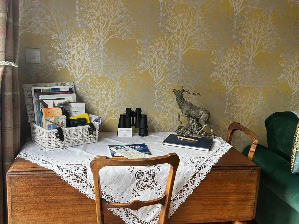 a table with a table cloth on top of it at The Guest suite at Daviot ,Inverness in Inverness