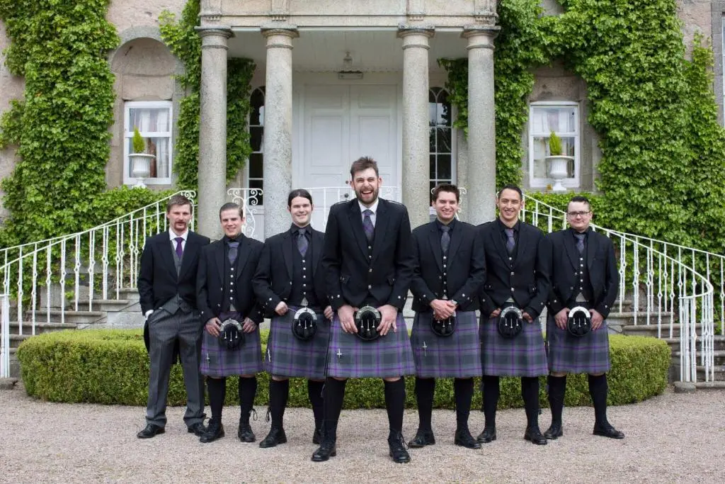 a group of men in suits and ties holding cameras at Cortes House in Fraserburgh