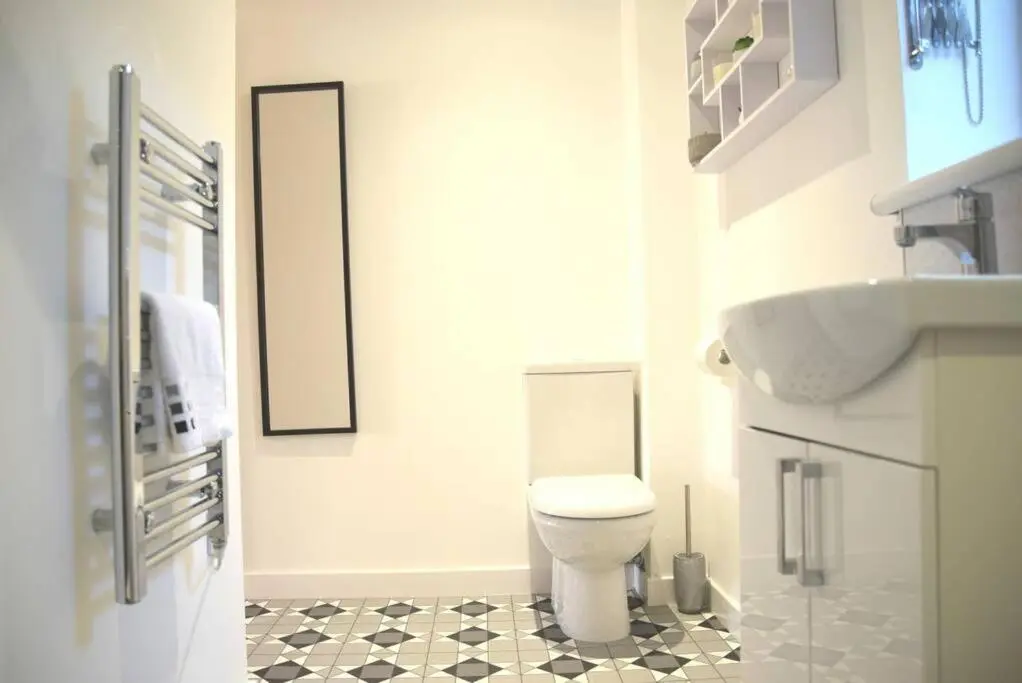 a bathroom with a toilet and a sink at Rammal Lodge - Entire home, self catering apartment in Inverness in Inverness
