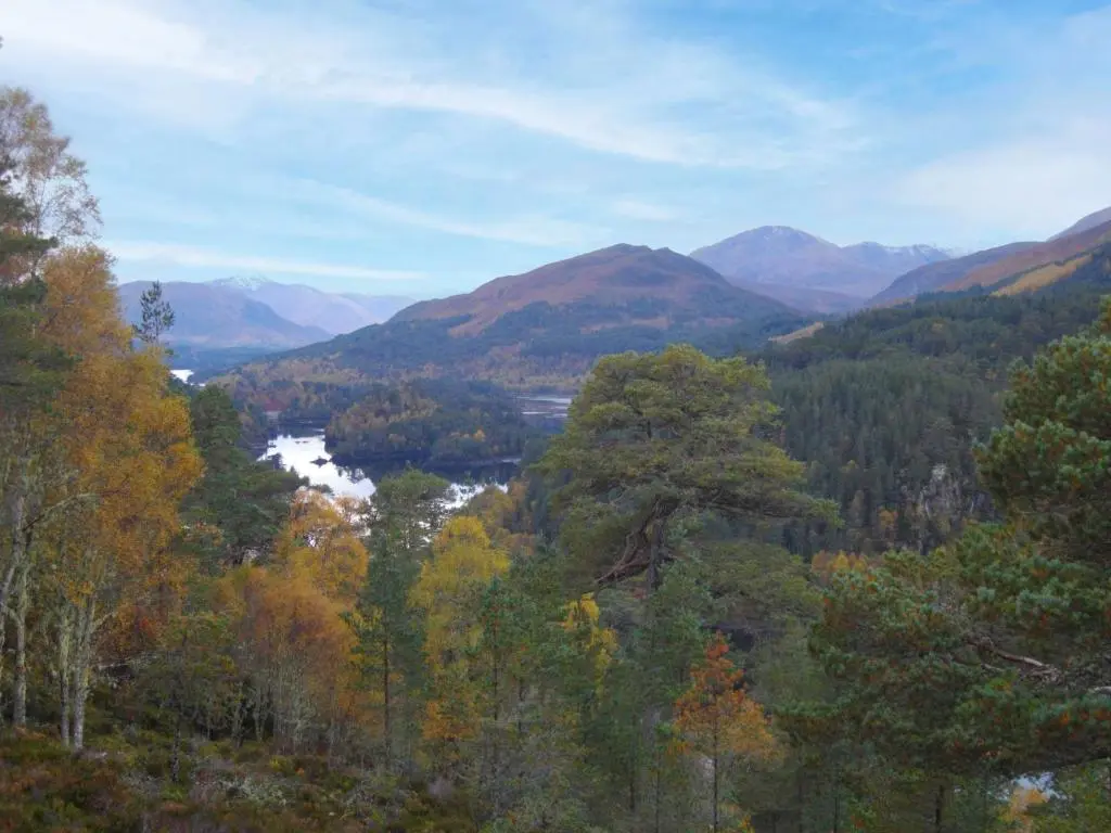 a view of a valley with a river and mountains at Divach Lodge at Lochletter Lodges in Drumnadrochit