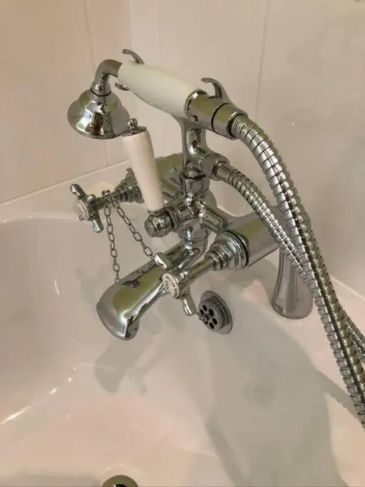 a bathroom sink with a chrome faucet at 3 BR Luxury Apt at Highland Club - Fort Augustus in Fort Augustus