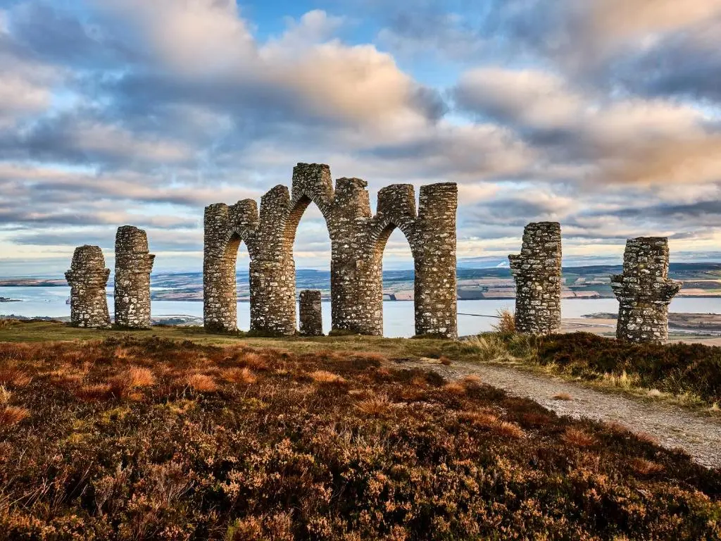 a group of tall stone structures on a field at The Dalmore Pod in Alness