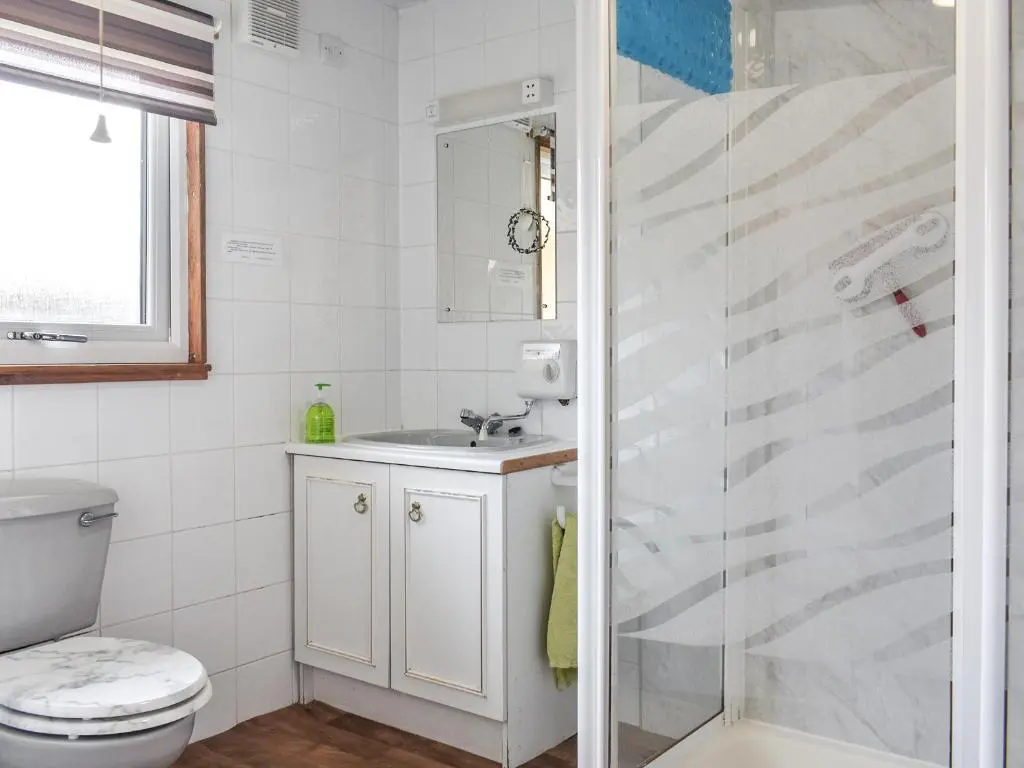 a bathroom with a shower and a sink at The Chalet - Ukc5786 in Nethy Bridge